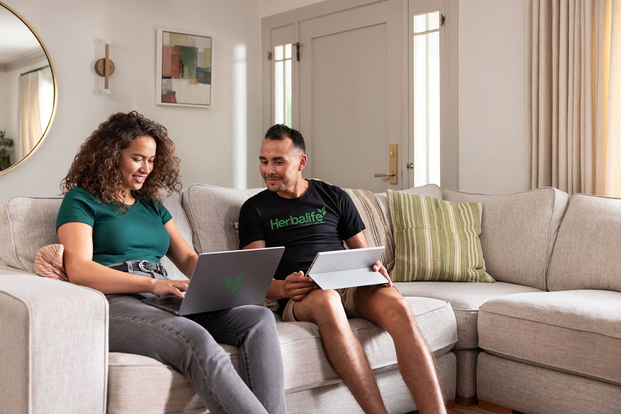 Friends on couch with laptops